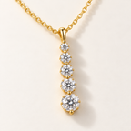 Amara Pendant Necklace on an off-white background