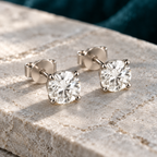 Clemence Stud Earrings on a pale stone slab