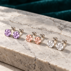 Daphne Stud Earrings on a pale stone slab