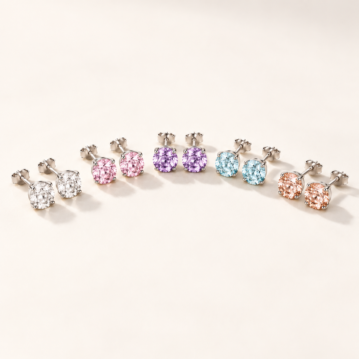 Daphne Stud Earrings colour range on an off-white background