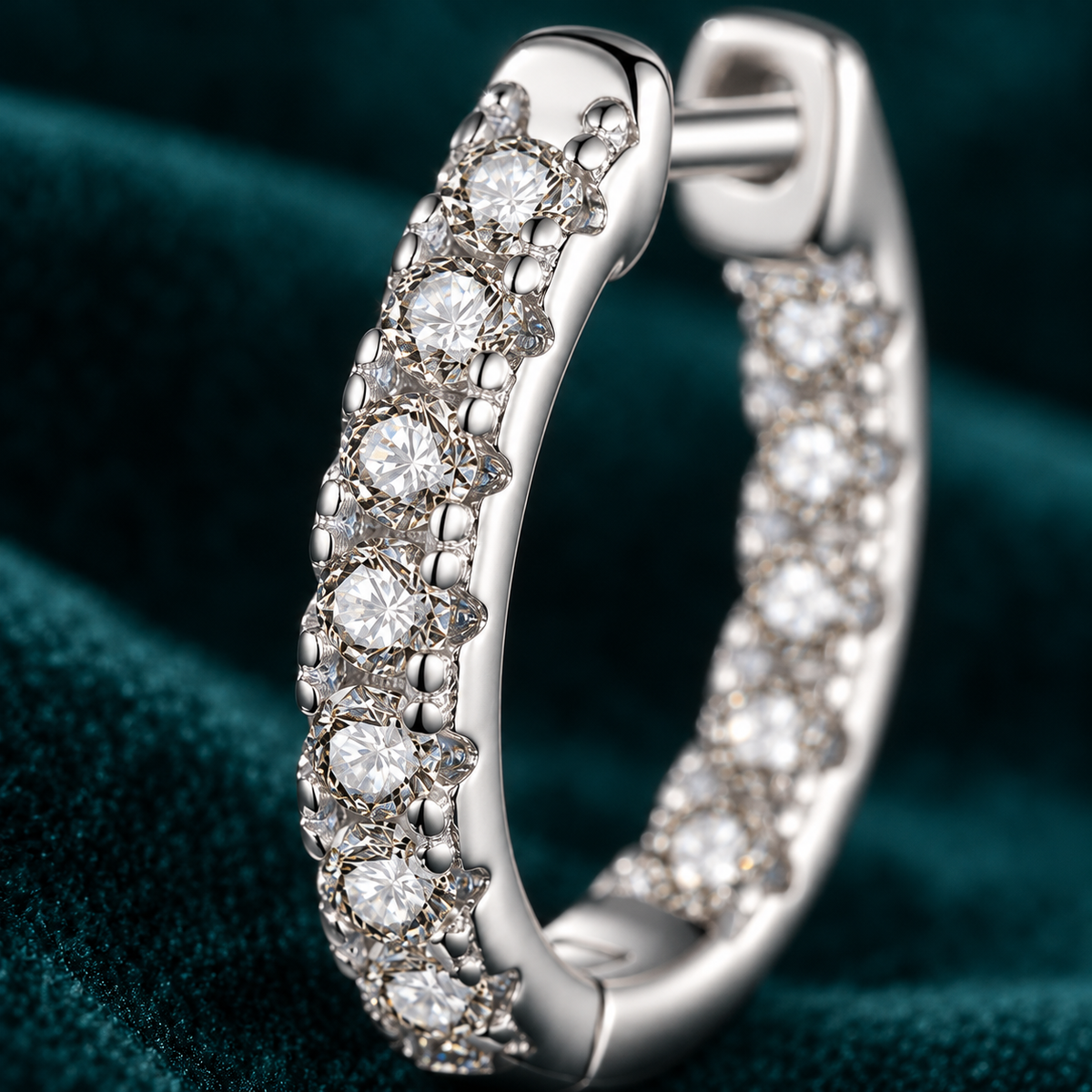 Thalia hoop close-up of the claw-set stone row and hinged clasp
