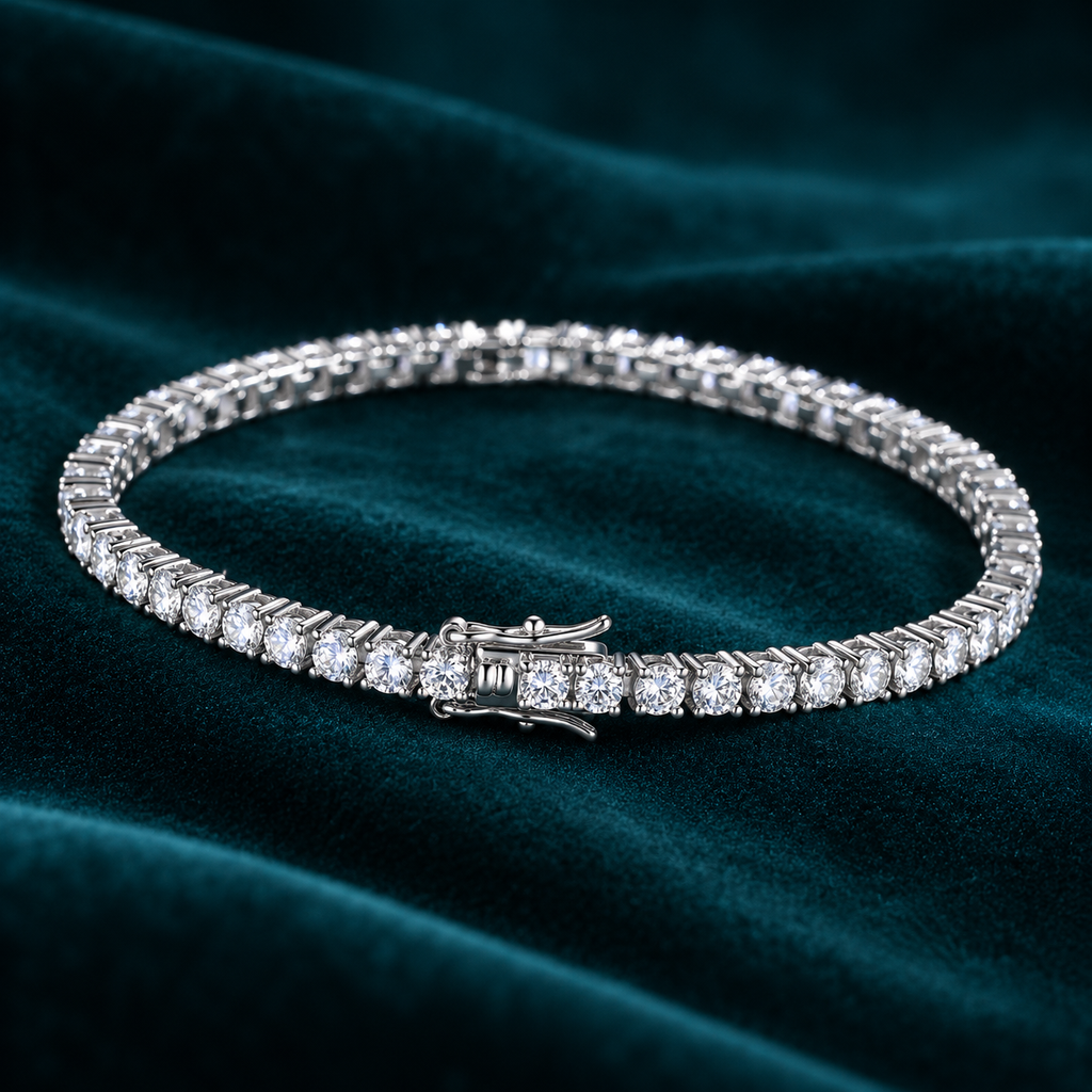 Vesper Tennis Bracelet: sterling silver tennis bracelet with a continuous line of round moissanite stones on teal velvet