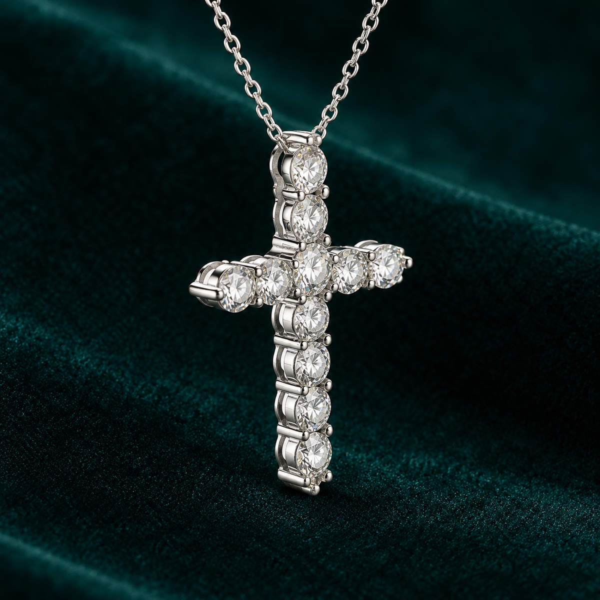 Viviane Cross Necklace: sterling silver cross pendant set with round claw-set moissanite stones on teal velvet