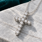 Viviane Cross Necklace on a pale stone slab